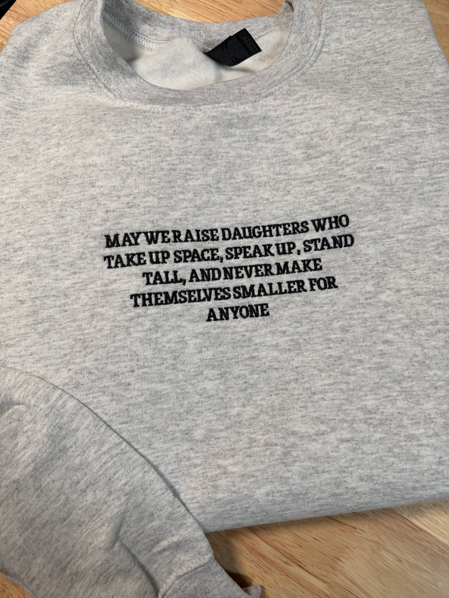 May We Raise Embroidered Apparel